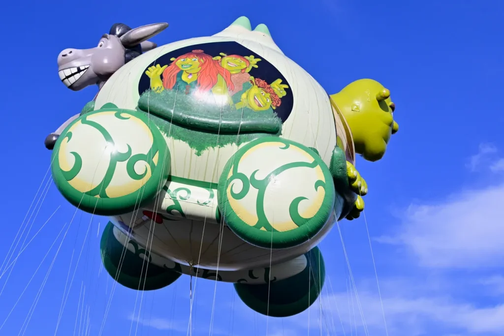 A picture of a parade balloon featuring movie characters Shrek and Donkey riding in an onion carriage through the Macy's Thanksgiving Day Parade illustrates the helium produced by an Otis, Kansas, gas plant to inflate the balloons for the iconic parade.